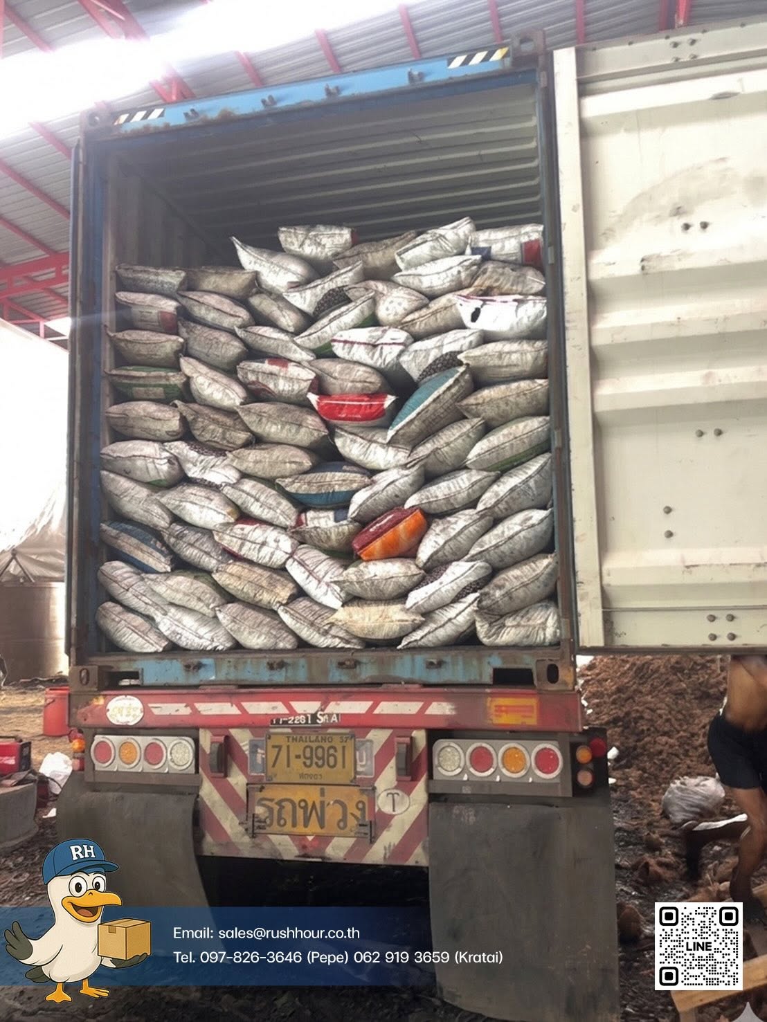 Container loaded with bagged cargo, with Rush Hour branding