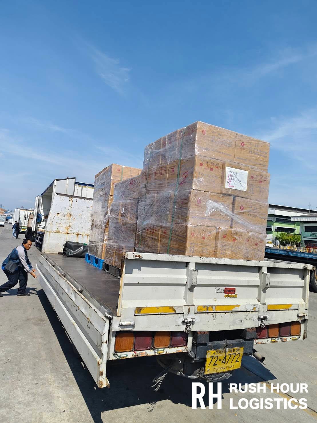 Wrapped cartons on pallets loaded on a delivery truck